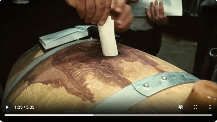 inserting into the wine barrel